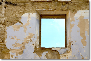 Window in cracked wall showing beautiful blue sky Window in cracked wall showing beautiful blue sky