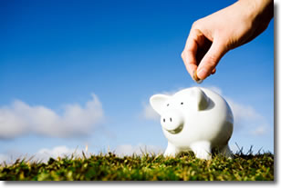 Saving money in a piggy bank Saving money in a piggy bank