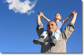 Child on father's shoulders