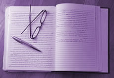 Journal with pen and eyeglasses